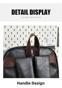 Detail of the durable top handle and reinforced shoulder strap on the black PU leather backpack