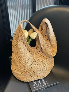 Floral woven straw tote bag with crochet hollow pattern for beach and vacation style
