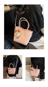 Detailed views of pink lychee pattern bucket bag with cute teddy bear charm on model