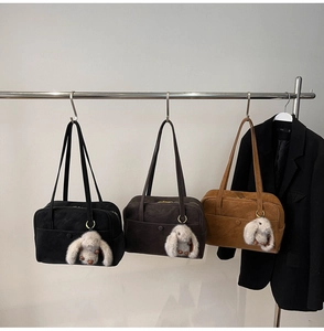 Three suede Boston bags in black, chocolate, and caramel with cute bunny plush charms
