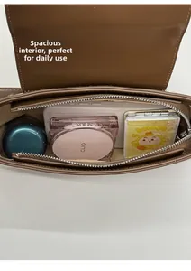 Macro view of the brown leather baguette bag interior with spacious storage for essentials
