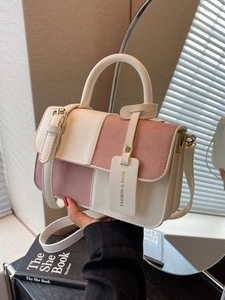 Minimalist color-block crossbody bag in cream and pink leather with single top handle