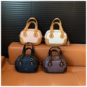 Boston handbags set in multiple colors with fine leather texture and golden rivet details