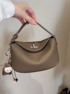 Taupe pebbled leather underarm shoulder bag with silver turn-lock and horse pendant
