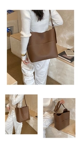 Detail of deep brown pebble leather bucket bag featuring functional front pockets