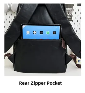 Detail of rear zipper pocket on black PU leather backpack for secure storage