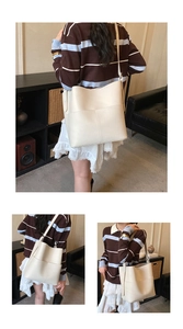 Detailed view of cream-white lychee grain tote bag with vertical stitching and large pocket