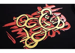 Macro detail of the street style graffiti bear print on a black cotton oversized t-shirt