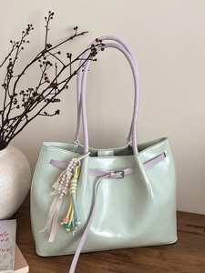 Minimalist mint green large capacity tote bag with purple handles and pearl charm accessory