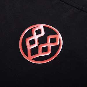 Oversized black t-shirt with red geometric bear logo print on textured cotton fabric