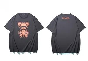 Detailed front and back view of charcoal grey oversized t-shirt with orange bear graphic
