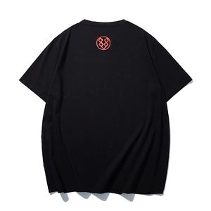 Oversized black crewneck T-shirt for men featuring a red circular graphic logo on the back