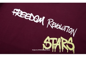 Detail of burgundy cotton T-shirt featuring white and neon graffiti freedom print