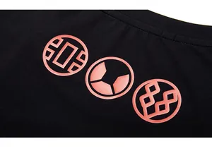 Detail of high-quality black cotton fabric featuring crisp pink orange geometric prints