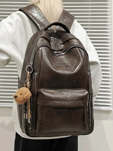 Large capacity dark brown PU leather backpack for men and women with teddy bear charm