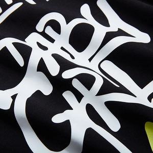 Oversized black cotton T-shirt with white graffiti letter print and premium texture