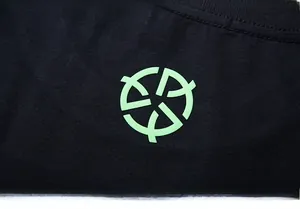 Macro shot of 250g cotton fabric texture with green geometric luminous logo print