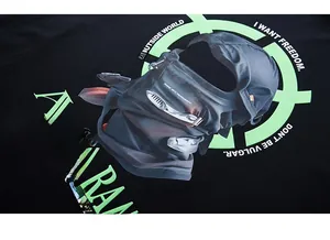Detail of glow-in-the-dark print on black oversized cotton t-shirt with street style