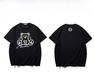 Flat lay showing both front and back views of a black oversized T-shirt with bear print