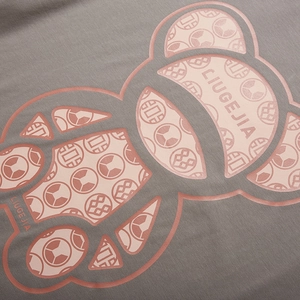 Dark gray oversize T-shirt with pink cartoon bear print and LIUGEJIA graphic lettering