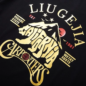 Oversized black cotton T-shirt featuring gold California polar bear print and letters