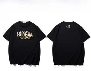 Detail of black T-shirt featuring gold snake print and I AM STRONGER lettering