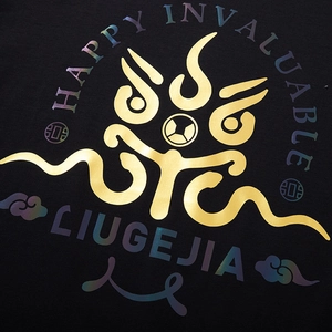 Oversized black cotton T-shirt featuring gold foil and colorful letter print design