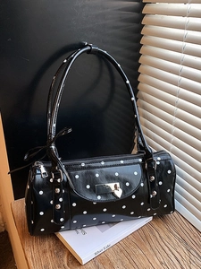 French vintage black polka dot cylinder handbag with bow detail and heart clasp
