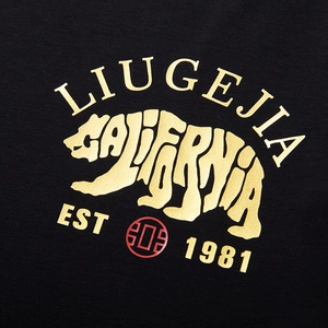 Oversized black cotton T-shirt featuring a golden polar bear and California letter print