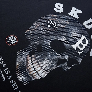 Oversized black cotton T-shirt featuring a detailed halftone skull print for streetwear style
