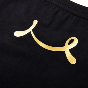 Men's loose black t-shirt featuring metallic gold abstract graphics and letter printing