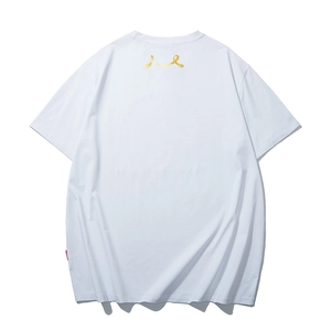 White oversized cotton t-shirt featuring golden back logo and red side label detail