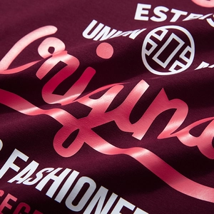 Burgundy oversized T-shirt with vintage fashion lettering and geometric logo print