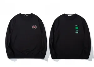Front view of black crewneck sweatshirts featuring graphic prints and ribbed necklines