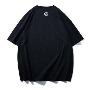 Oversized black crewneck T-shirt with drop shoulders and a green back collar logo