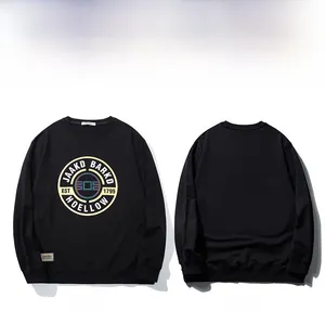 Detail of black crewneck sweatshirt featuring vintage graphic print and woven side label