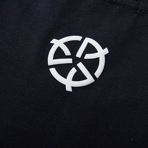 Black cotton t-shirt featuring a white circular geometric logo on the chest area