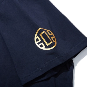 Navy blue cotton T-shirt featuring high-quality gold foil logo detail on the short sleeve