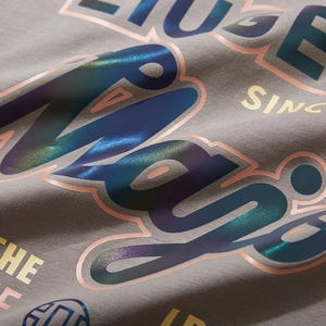 Oversized grey T-shirt featuring holographic laser reflective artistic typography print