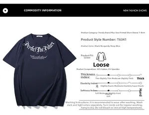 Detail of gothic white lettering on navy blue oversized cotton t-shirt fabric