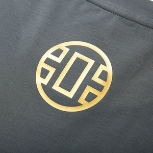 Deep grey oversized T-shirt with premium golden metallic printed logo detail