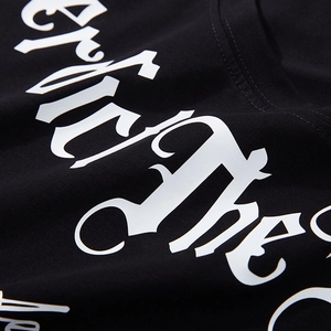 Oversized black cotton T-shirt with white gothic letter print and soft fabric texture