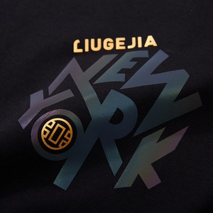 Black cotton T-shirt featuring gold foil lettering and iridescent New York reflective print