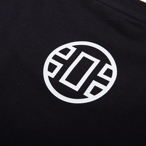 T-shirt noir surdimensionné en coton avec imprimé géométrique circulaire blanc minimaliste