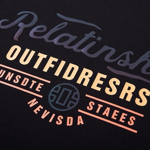 Close-up of black oversized T-shirt with vibrant colorful typography and knitted texture