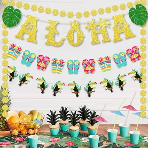 Detail view of Aloha banner and tropical bird decorations for Hawaiian beach party setup