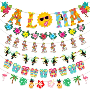 Close-up of vibrant Hawaiian party banners with flamingo, pineapple and ALOHA letters