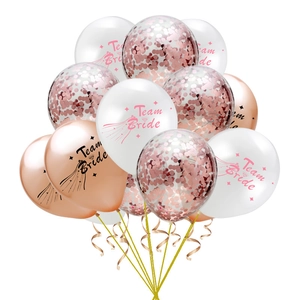 Detail of rose gold confetti balloons and Team Bride printed latex balloons with ribbons