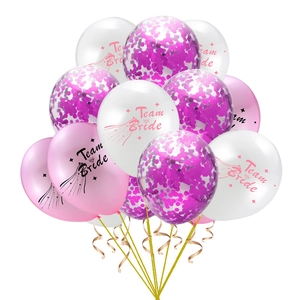 Detailed view of Team Bride balloons with rose gold confetti for wedding shower decor