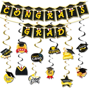 Congrats Grad banner and spiral hanging swirls in black gold and white for 2026 graduation party